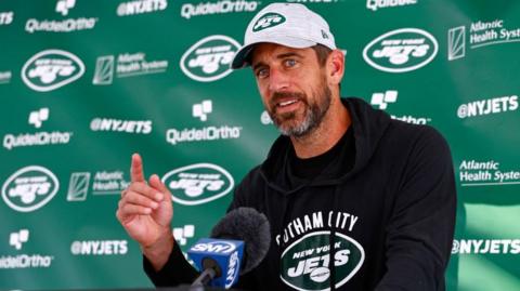 Aaron Rodgers speaks at a New York Jets news conference
