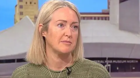 Esther Ghey appeared on BBC Breakfast, sitting on the couch in the studio in a green jumper looking to the right of the camera, towards the presenters