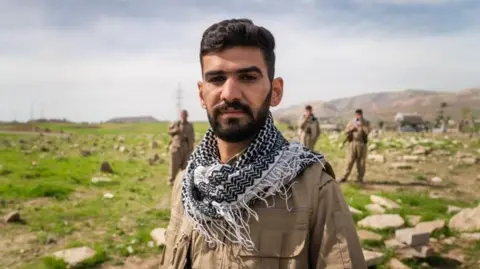 Matthew Goddard / BBC Hassan, a fighter at the Democratic Party of Iranian Kurdistan 