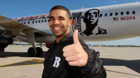 Drake in 2010, standing in front of a plane advertising his R&B-styled debut Thank Me Later