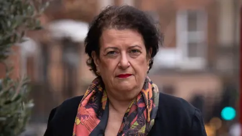 PA Media Retired senior judge Deborah Taylor KC outside Mary Ward House in London