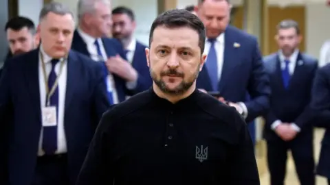 EPA-EFE/REX/Shutterstock Ukrainian President Volodymyr Zelensky walks in Brussels after a crisis EU summit. Photo: 6 March 2025