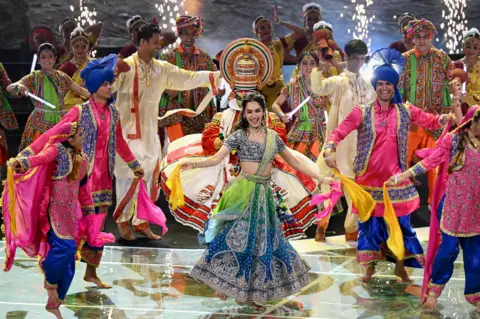 Getty Images Manushi Chhillar performs with the Shiamak Davar Dance Troupe during the Closing Ceremony