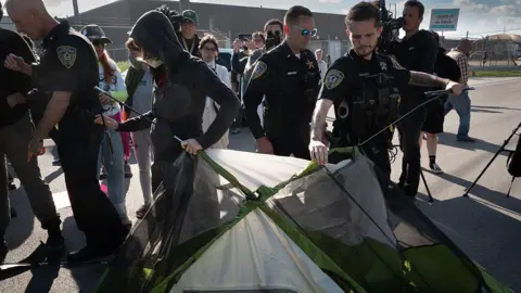 Getty Images removed the tents that the demonstrators use to prevent the entrance to the car into an ice facility outside the Chicago