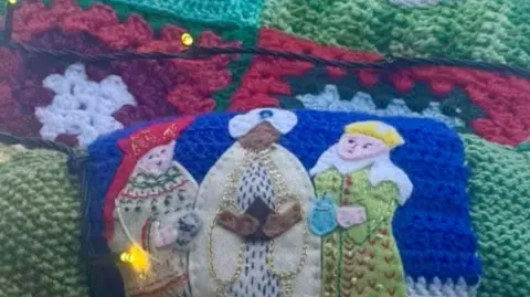 Michele Ryan A close up of one of the knitted squares, this one showing an image of the Three Wise Men carrying their gifts.