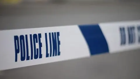A close-up picture of police tape. 