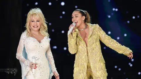 Getty Images Dolly Parton and Miley Cyrus performed at the 61st Annual Grammy Awards in 2019.