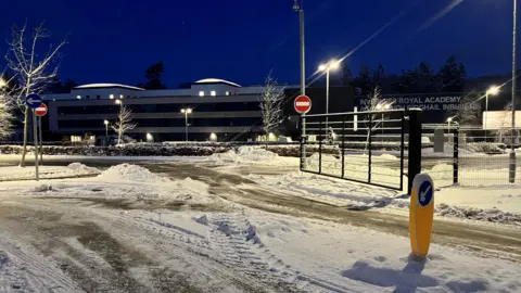 Inverness Royal Academy pictured from the school gates, with the road covered in snow