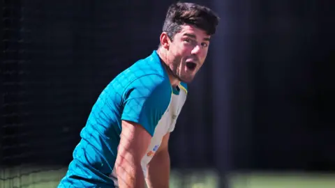 Moises Henriques looks exasperated during a training session for Australia in 2022