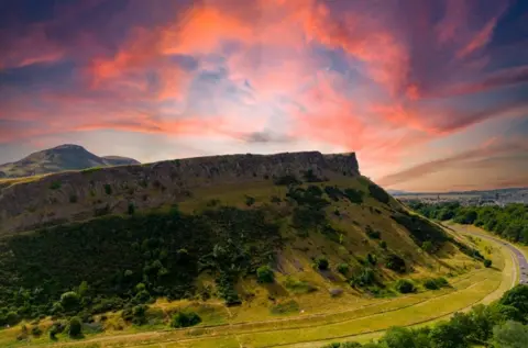 Getty Sunrise over Salisbury Crags with Arthur's Seat in the background