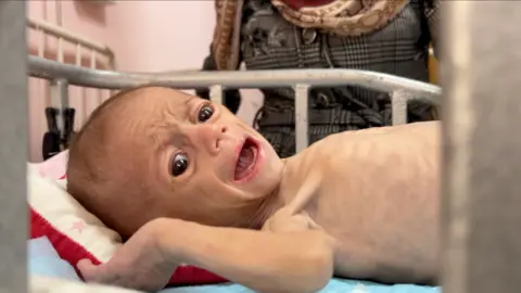 Baby Siwar lies down crying in distress