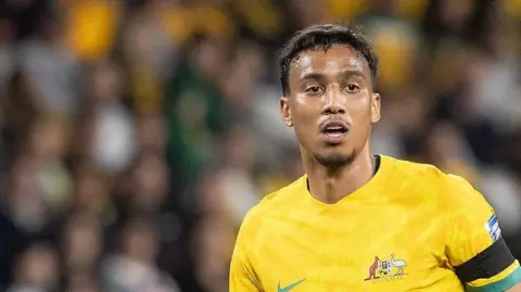 Keanu Baccus in action for Australia at the 2022 World Cup