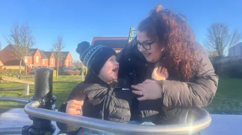 Supplied Rupert with his mum Mollie while on an accessible roundabout in Rainworth