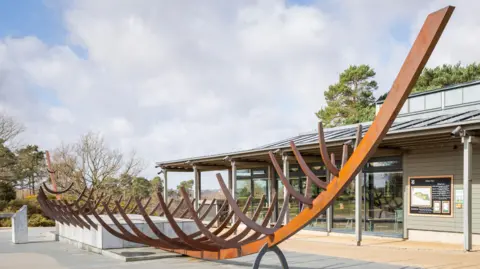 National Trust The sculpture of the Great Ship Burial in the courtyard at Sutton Hoo