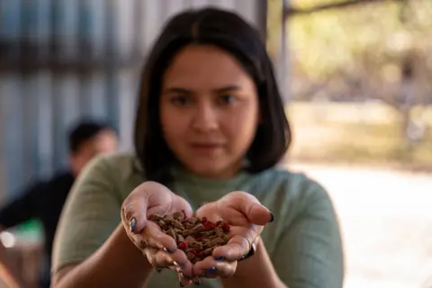 Fritz Pinnow Paola Acevedo holds a small battery of refined foods for dogs.