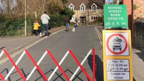school streets barrier with road closure sign