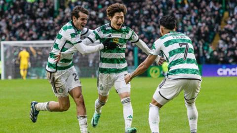 Celtic's Kyogo Furuhashi celebrates with Paulo Bernardo and Luis Palma
