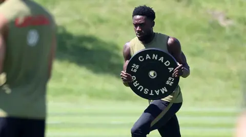 Toronto Star via Getty Images Alphonso Davies of Canada practices as Canada's FIFA 2026 World Cup team trains