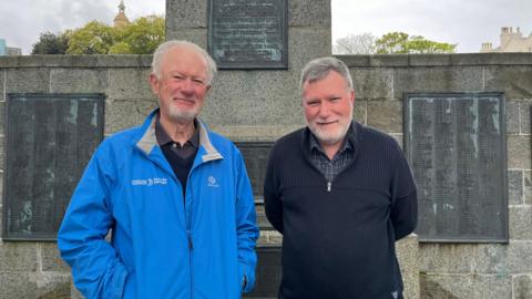 Image of Angus Bodman and Kevin McLagan from Piping Guernsey standing next to each other