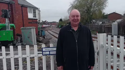 Dennis Fancett  Dennis Fancett at Bedlington station with the line behind 