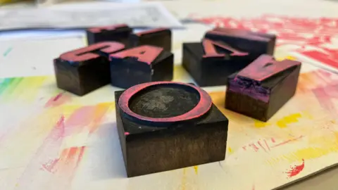 Shaun Whitmore/BBC Kate Rolfe's illustrating