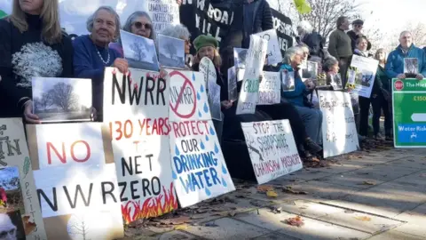 BBC Protestors holding placards outside Shirehall, Shrewsbury