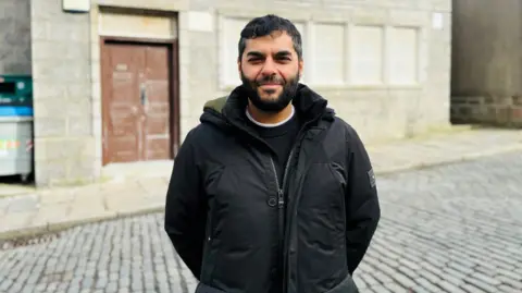 Man - Naveed Mohammed, chairman of the Aberdeen Mosque and Islamic Centre - outside the mosque.