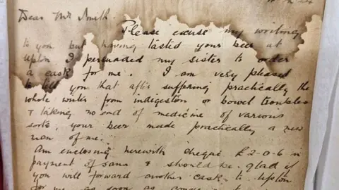 Wolverhampton City Archives A stained yellow image of a letter from Mr Wynn detailing the medicinal properties of Banks's beer.
