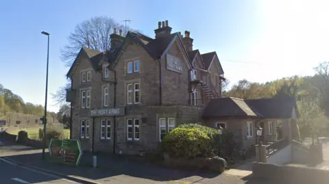 Google The exterior of the stone-built Hurt Arms pub