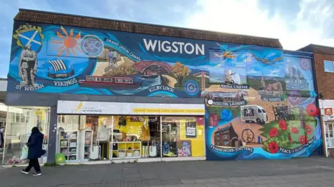 An image of a mural in Wigston painted on a building wall