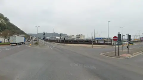 A road junction with a ferry port in the background