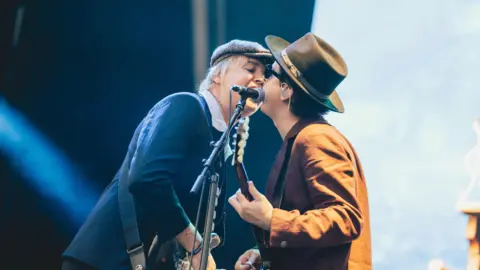 Luke Brennan/Getty Images Pete Doherty (left) and Carl Barât (right) of The Libertines perform on The Big Gin main stage