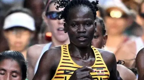 Alamy Uganda's Rebecca Cheptegei successful  enactment   during the women's marathon final
