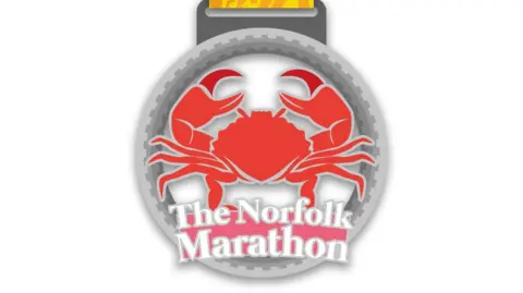 EPIC Norfolk Norfolk marathon medal with a crab on it