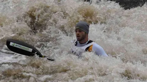 Mike Lambert/PA Media Mike Lambert kayaking in rough waters