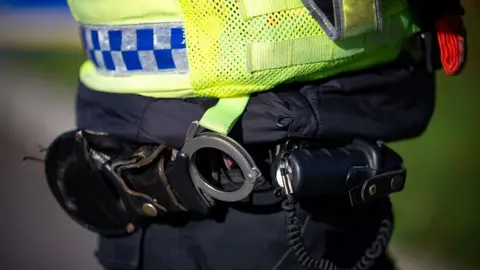 A stock photo of a police officer's handcuffs.