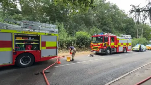 Fire engines at scene of grassland fire