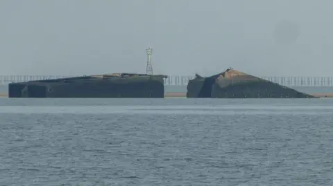 The remains of a D-Day Mulberry Harbour in the sea of Thorpe Bay, Essex