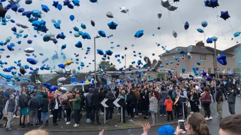 BBC Hundreds of people release balloons in memory of Ellis Lockley