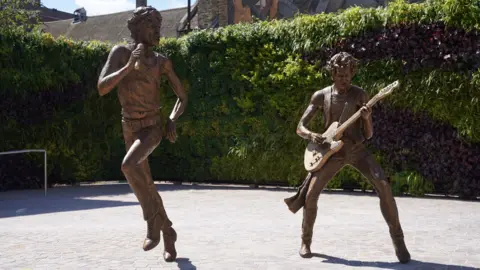 Statues of two men. 