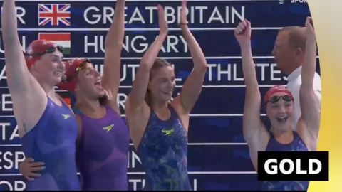 Team GB's women's freestyle relay team celebrate