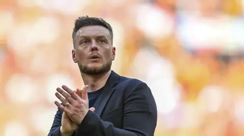 Kim Hellberg applauds fans after losing to Hull at Wembley 