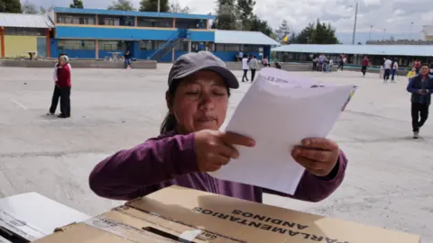 Reuters A person votes, on the day of the presidential and parliamentary election, in Tanicuchi, Cotopaxi, Ecuador