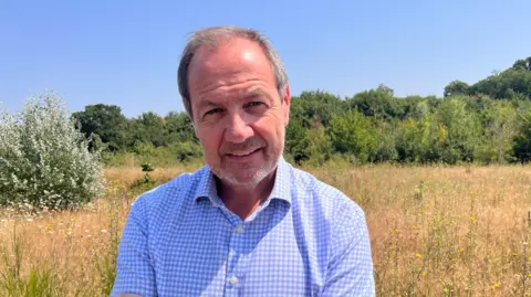 Sean Connor, Managing Director of Gallagher Aggregates Ltd standing on previously quarried land at Hermitage Lane in Barming which is being restored to natural braodleafed woodland