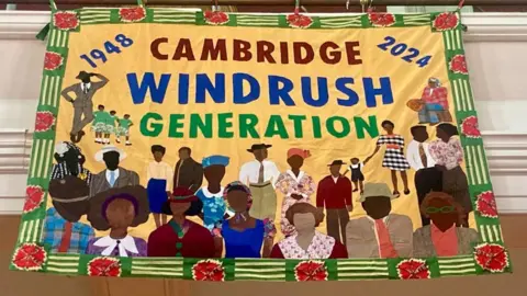 Mousumi Bakshi/BBC A Windrush banner