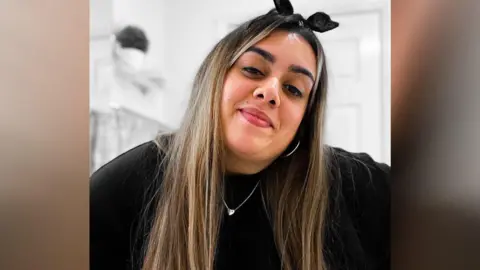 Malika Speaks Mallika Speaks smiling for the camera 