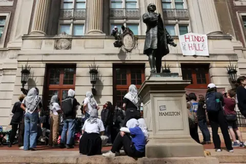 Student protesters move supplies from outside Hamilton Hall, where students at Columbia University barricaded themselves to protest in support of Palestinians