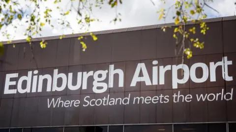 Bloomberg The side of a building at Edinburgh Airport carries the slogan 'where Scotland meets the world'.