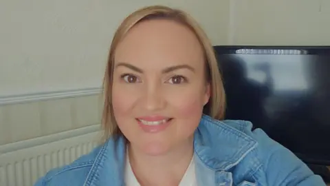Linzi Bowden Linzi Bowden is a 46-year-old woman with light brown hair and brown eyes and straight shoulder-length hair. She is wearing a blue denim jacket.