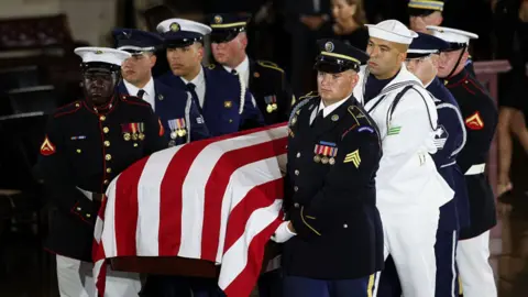 Lindsey Graham's casket arrives at the Capitol.